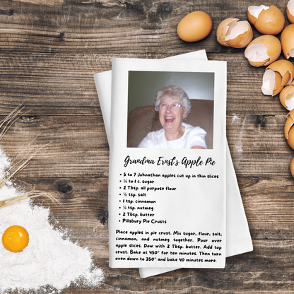 Recipe card for Grandma Ernst's Apple Pie with a photo of an elderly woman on a wooden surface with eggs and flour.