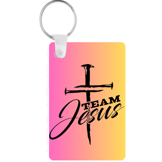 Keychain with 'Team Jesus' design on a pink to yellow gradient background