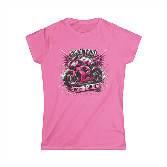 A pink t-shirt with a motorcycle that has a pink paint job. The motorcycle is coming out of a splash of silver and black background. Includes the text "Born to Ride, Born to Shine"