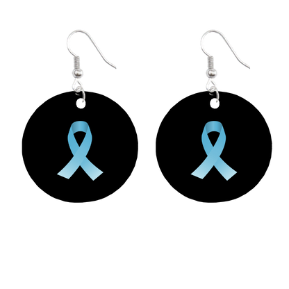 Earrings with blue ribbon design on black circular pendants against a white background for prostate cancer awareness